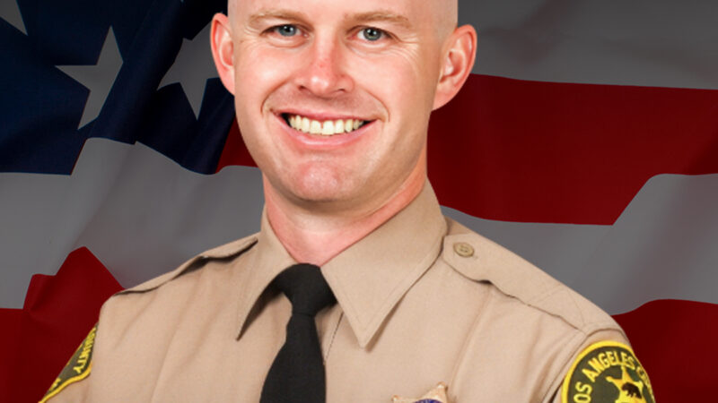 Official portrait of Deputy Ryan M. Clinkunbroomer with American Flag behind and date of death below.
