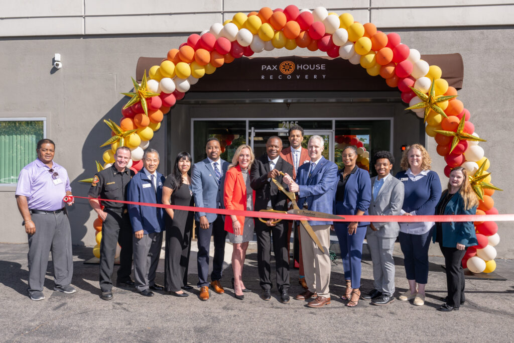 Supervisor Barger, PAX House staff, and community partners cut the ribbon outside the new PAX Recovery House facility in Pasadena.