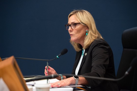Supervisor sits at the dais.