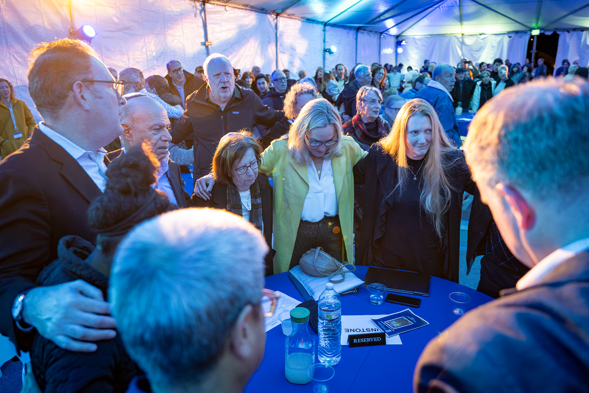 Supervisor Barger and attendees stand and recite a prayer together.