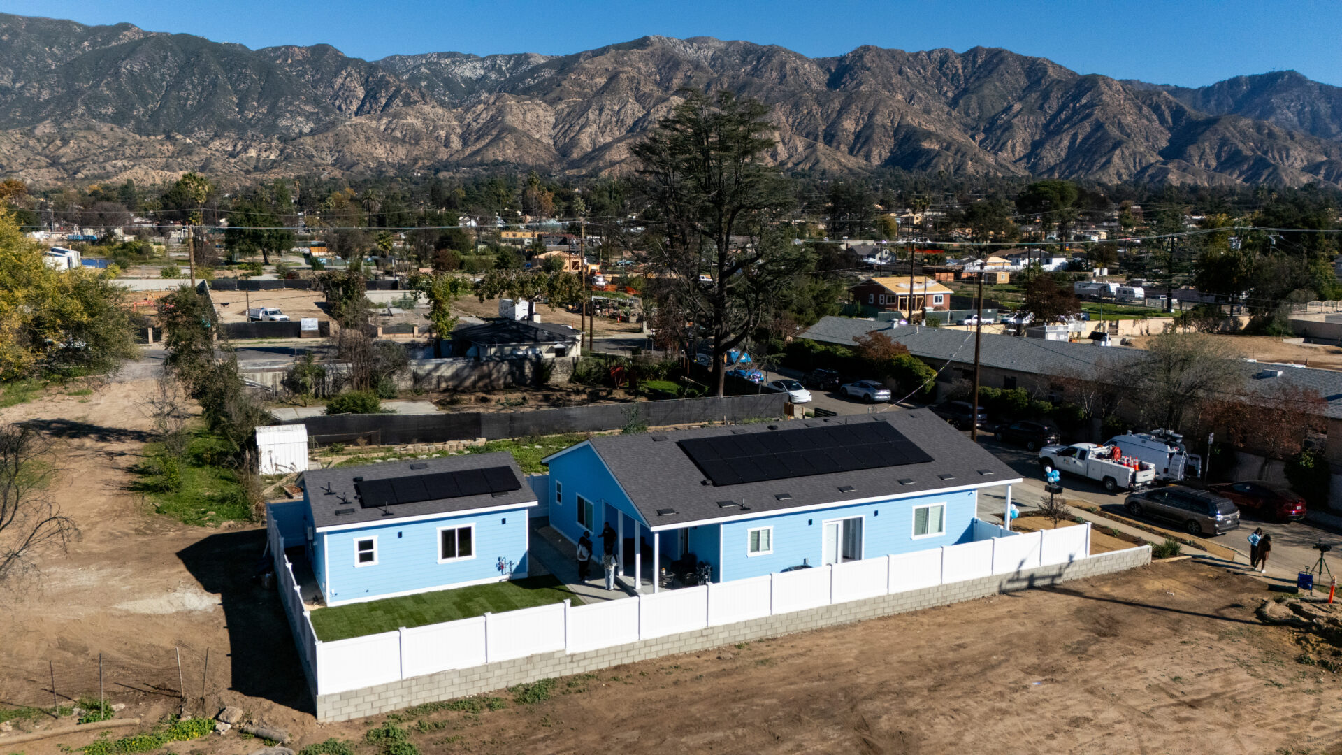 An aerial view of a rebuilt home featuring a newly constructed accessory dwelling unit within the Eaton Fire burn area.