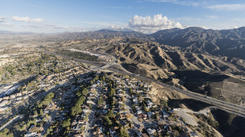 Aerial cityscape view of suburban sprawl in the Santa Clarita community of Los Angeles County, California.