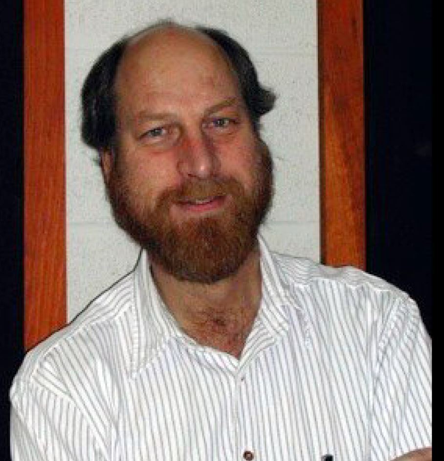 Dr. Carl Grillmair, man with beard and striped shirt.