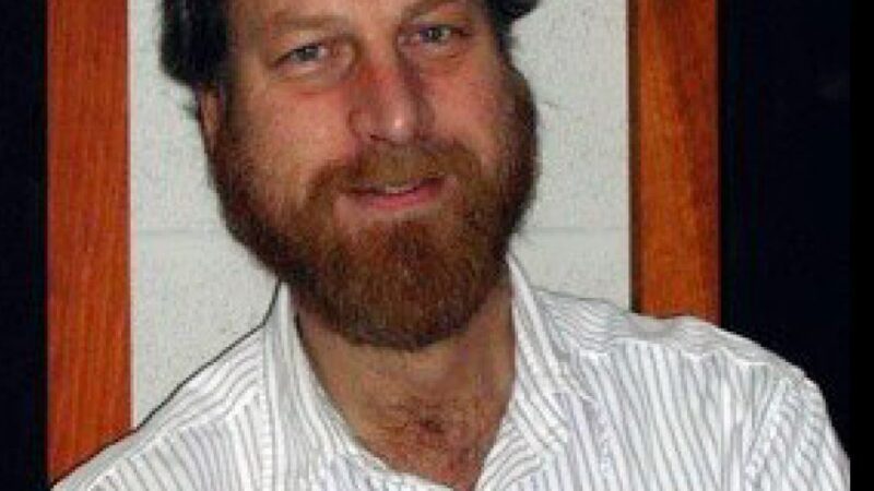 Dr. Carl Grillmair, man with beard and striped shirt.