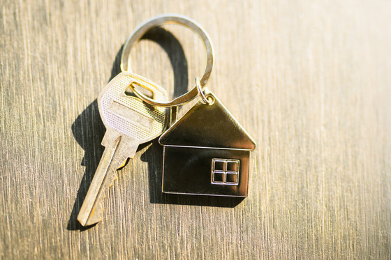 Key with home-shaped keychain