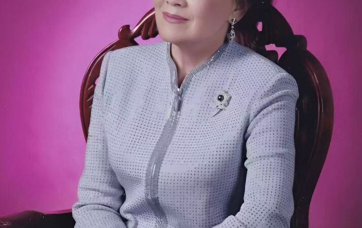 Ms. Sue Zhang pictured in a formal studio setting.